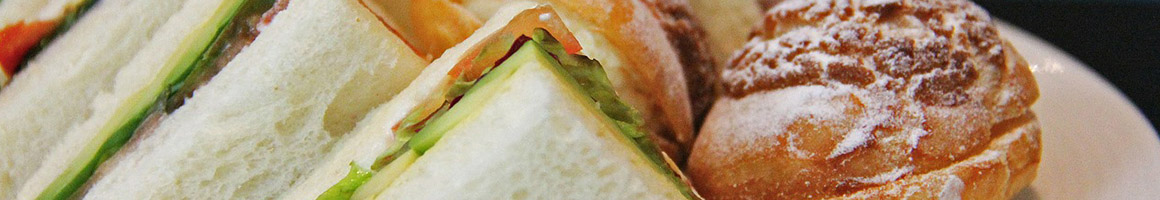 Eating Sandwich at Bagel Me! restaurant in Orange, CA.